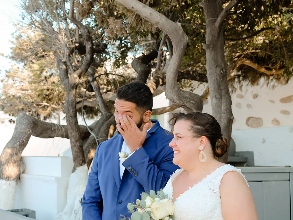 Bernhard, moved to tears, wipes his eyes while Lisa smiles.